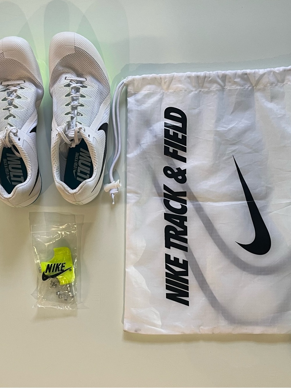 Nike White and Neon Green Track Shoes with Accessories